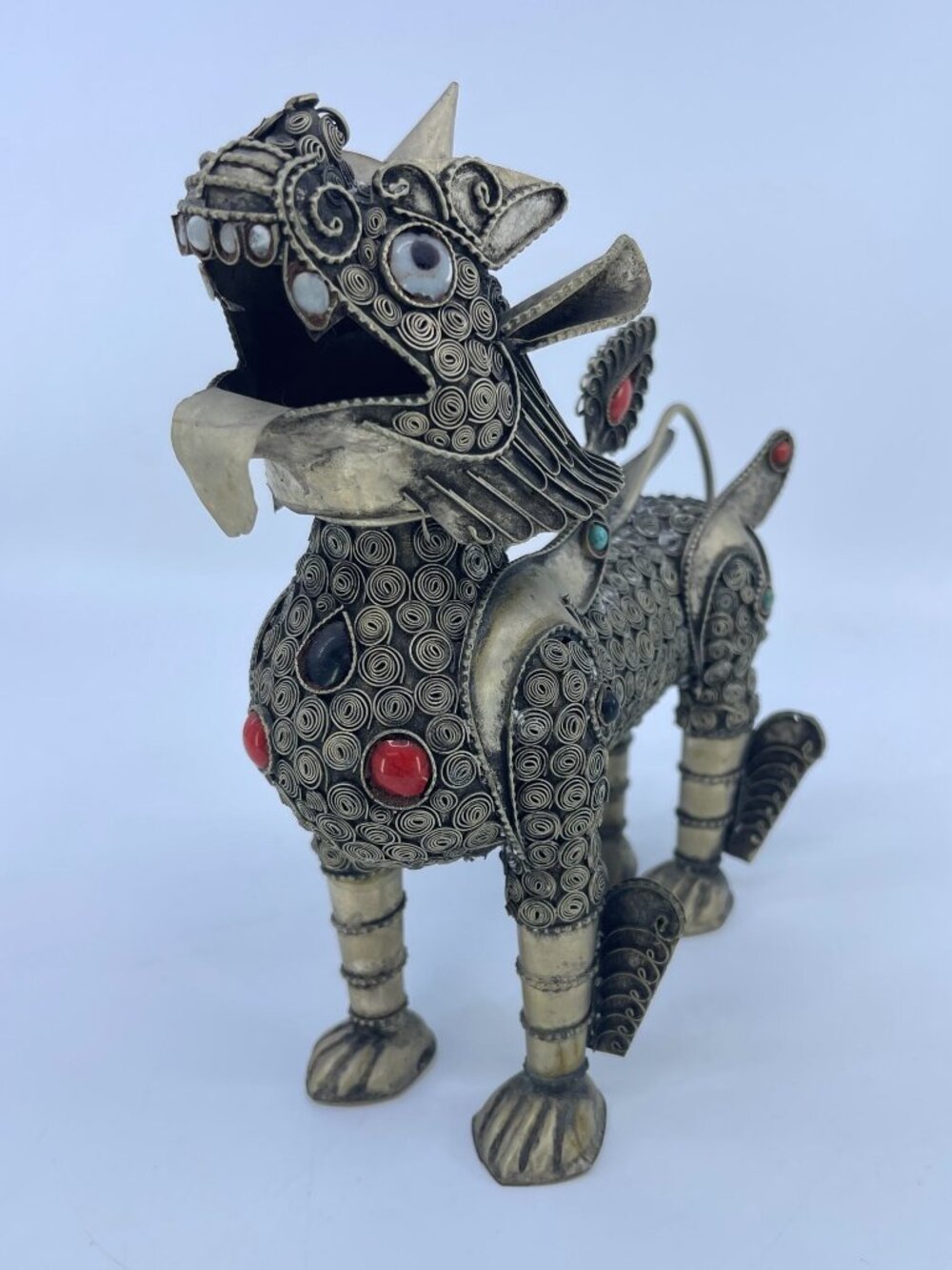 vintage intricately detailed south east asian filigree temple guardian figurine